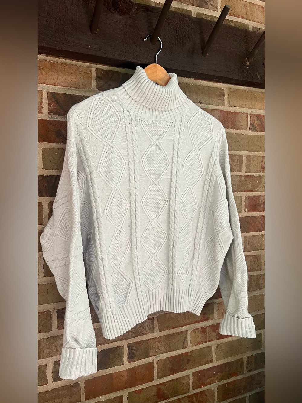 Cable-Knit Turtleneck Sweater in Cream